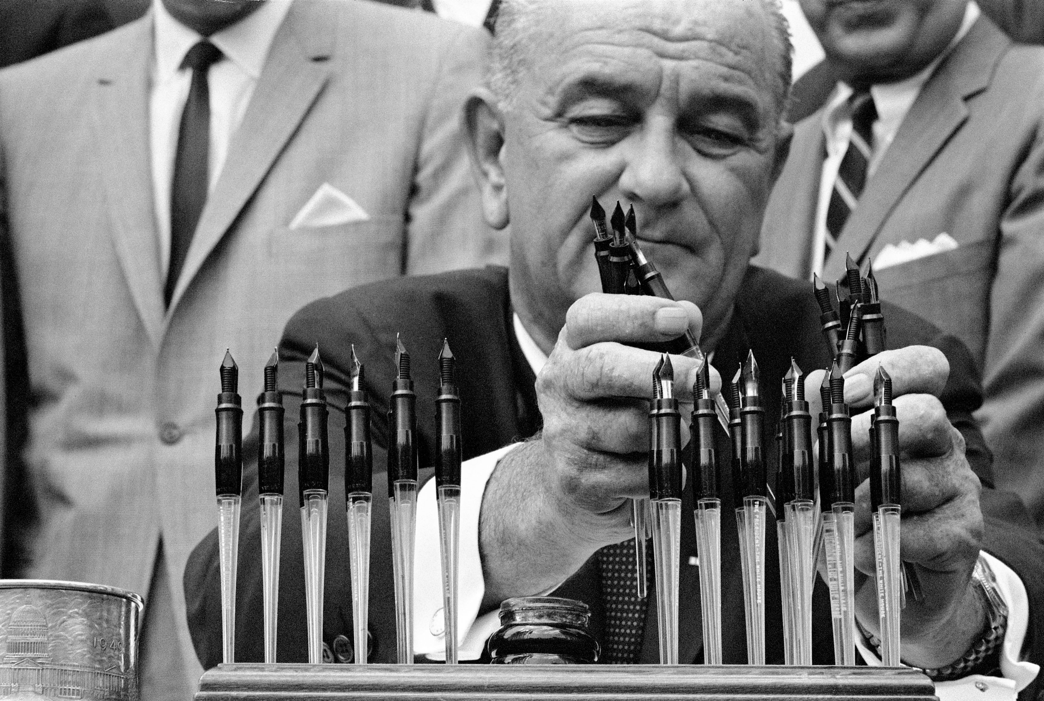 President Lyndon B. Johnson with his bill signing pens at the Housing and Urban Development Act signing.